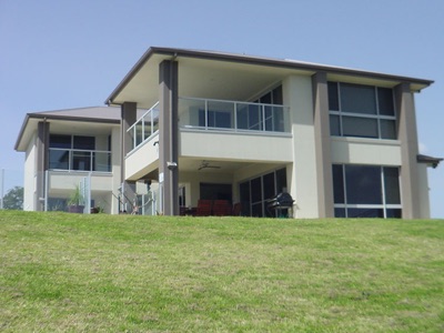 one off waterfront design home — rear/exterior