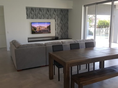 Open-plan family and dining space in a Reefsea home