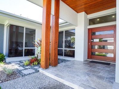 Timber-columned entry of a Reefsea custom home